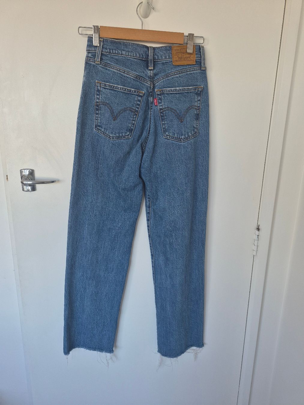 Back view of Levis Ribcage Straight Jeans Size 26, preloved designer clothing at Copper & Cotton